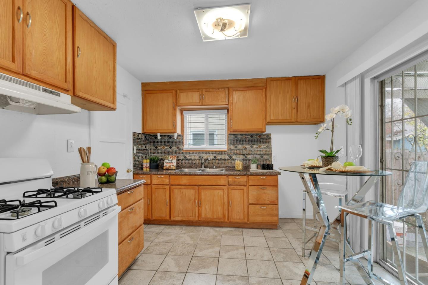 809 Modoc Street Vallejo, CA 94591 - Photo 10 of 31 a kitchen with a stove a sink and a refrigerator