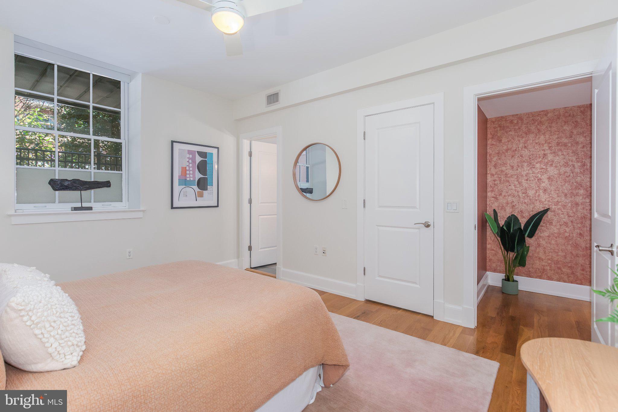 215 I Street Northeast, Unit 105 Washington, DC 20002 - Photo 30 of 41 a bedroom with a bed and a window
