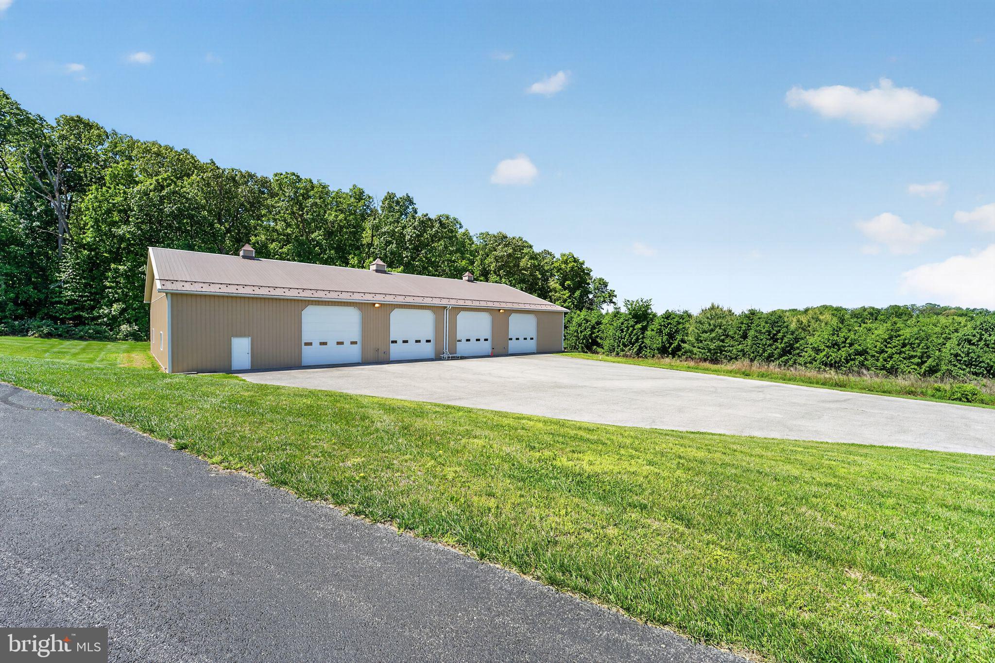 1165 Line Road Westminster, MD 21158 - Photo 56 of 75 a front view of a house with a yard and garage
