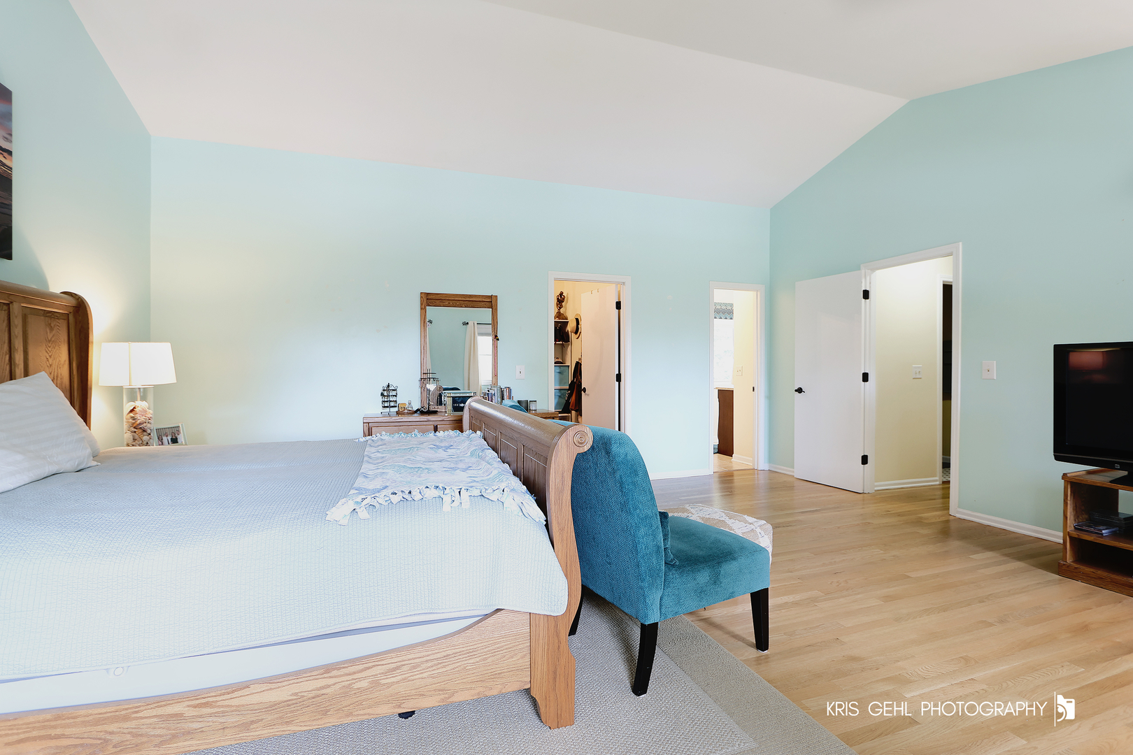 526 Whispering Pines Road Lindenhurst, IL 60046 - Photo 13 of 38 a living room with furniture a flat screen tv and a refrigerator