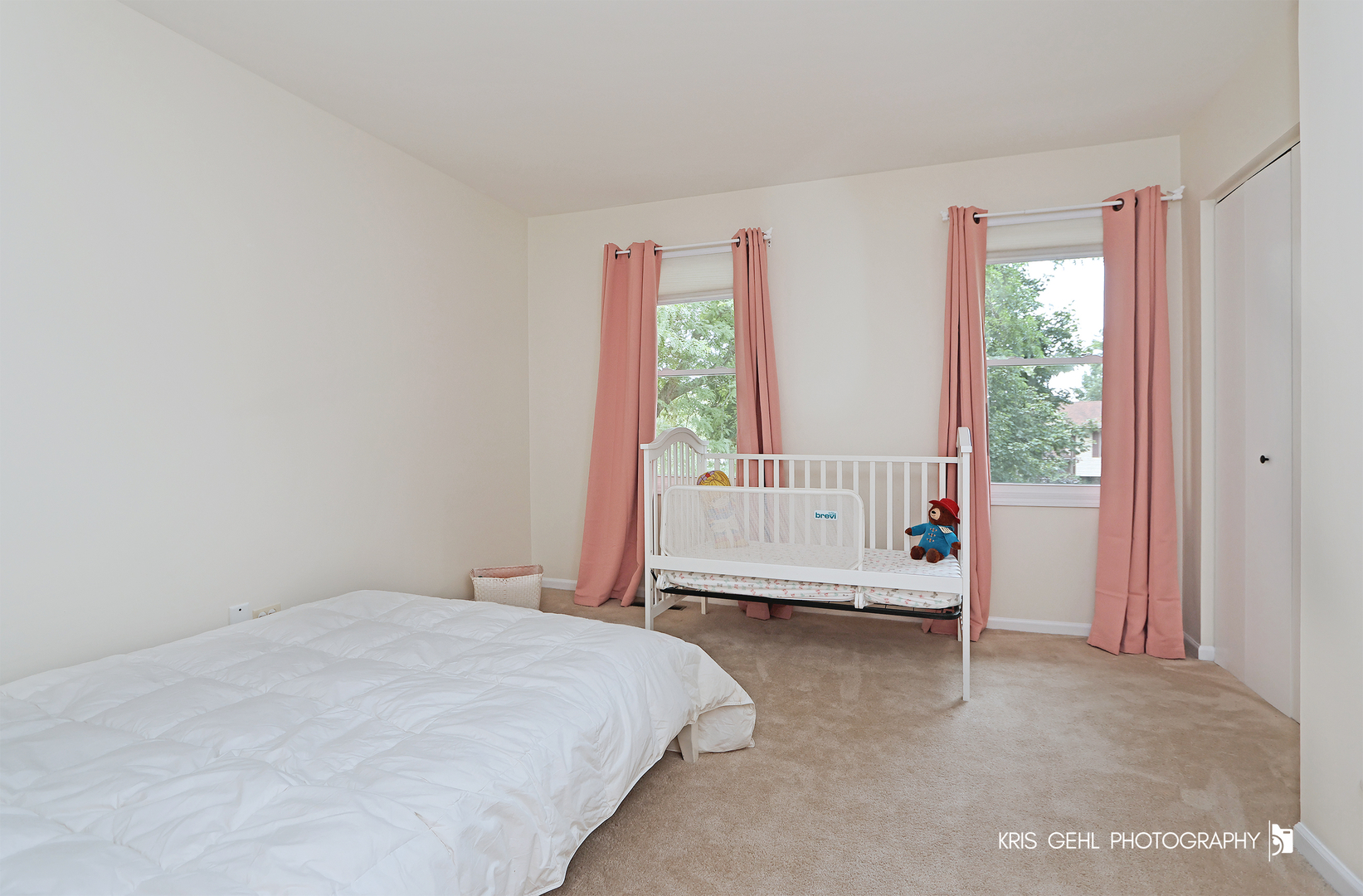 526 Whispering Pines Road Lindenhurst, IL 60046 - Photo 16 of 38 a bed sitting in a bedroom next to a window