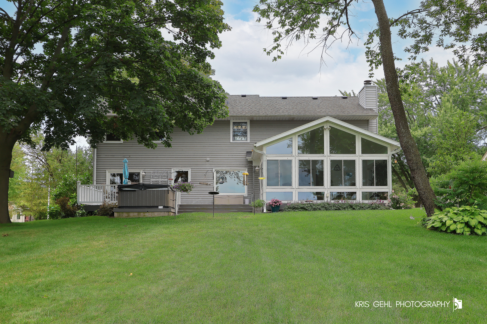 526 Whispering Pines Road Lindenhurst, IL 60046 - Photo 34 of 38 a view of a house with a yard and sitting area