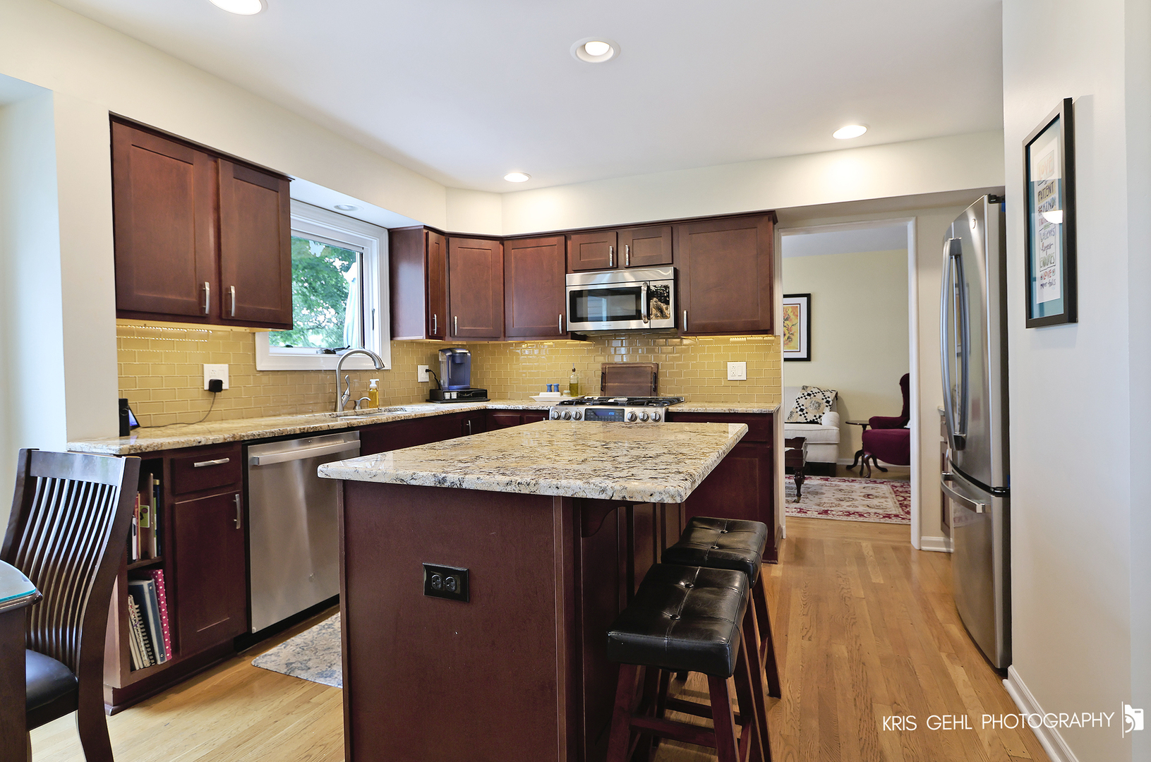 526 Whispering Pines Road Lindenhurst, IL 60046 - Photo 4 of 38 a kitchen with stainless steel appliances granite countertop a sink refrigerator and cabinets