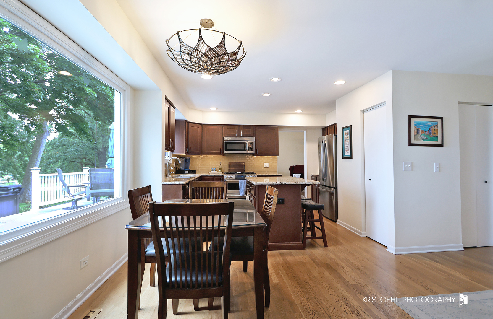 526 Whispering Pines Road Lindenhurst, IL 60046 - Photo 5 of 38 a view of a dining room with furniture window and wooden floor