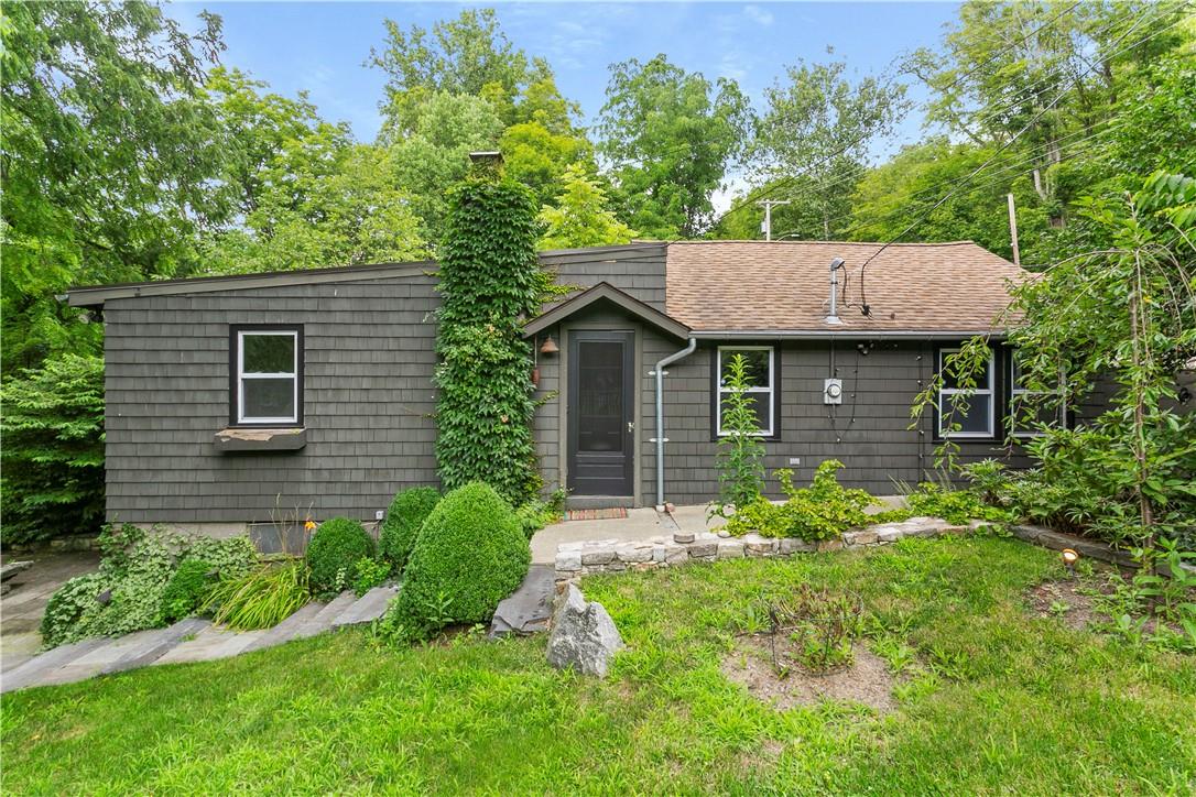 View of front of property with a front yard