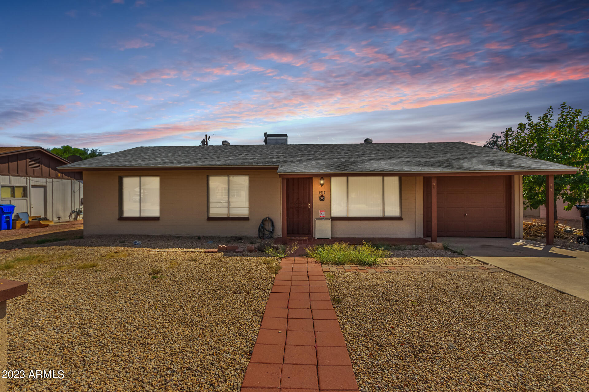 1519 West St John Road Phoenix, AZ 85023 - Photo 1 of 13 a front view of a house