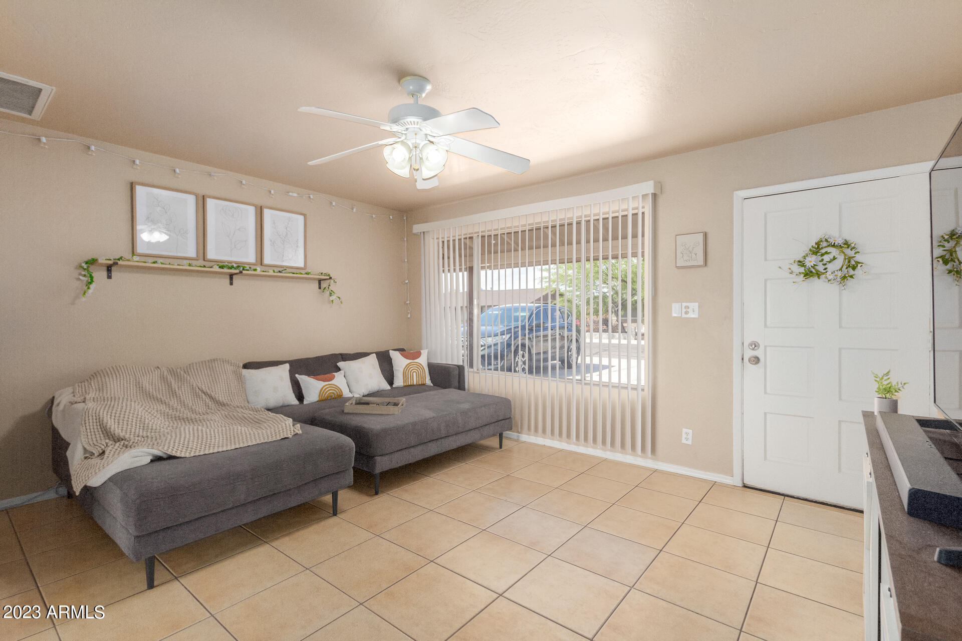 1519 West St John Road Phoenix, AZ 85023 - Photo 3 of 13 a living room with furniture and a window