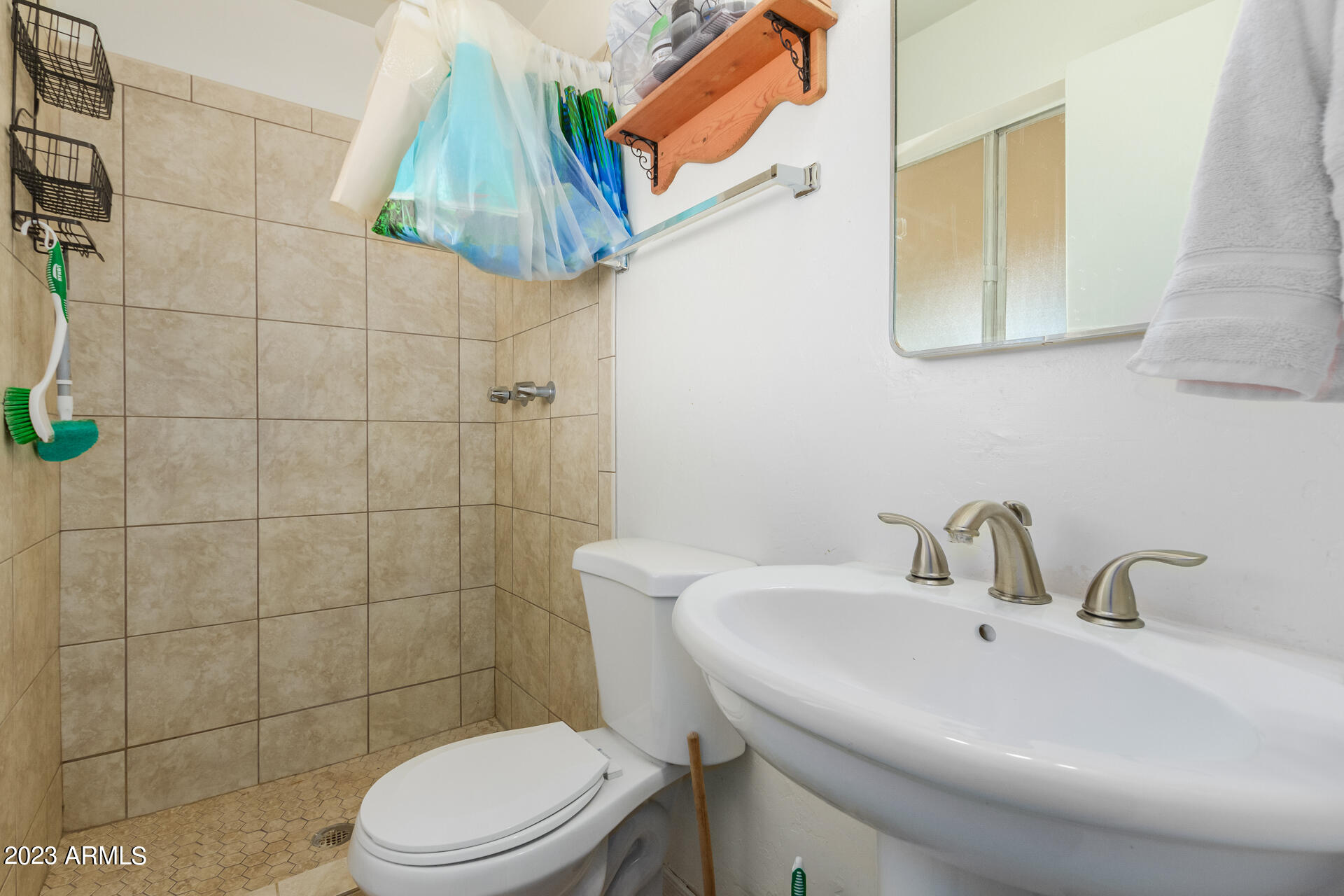 1519 West St John Road Phoenix, AZ 85023 - Photo 7 of 13 a bathroom with a sink a toilet and shower