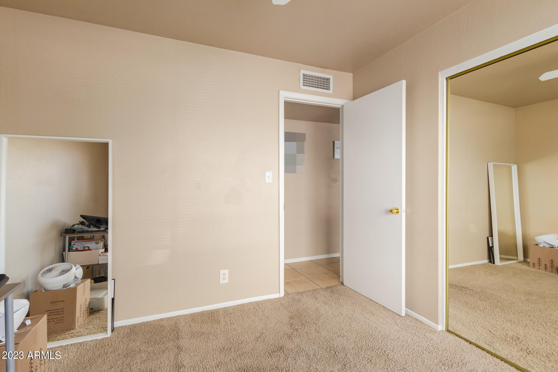 1519 West St John Road Phoenix, AZ 85023 - Photo 9 of 13 a view of room with wooden floor and bathroom