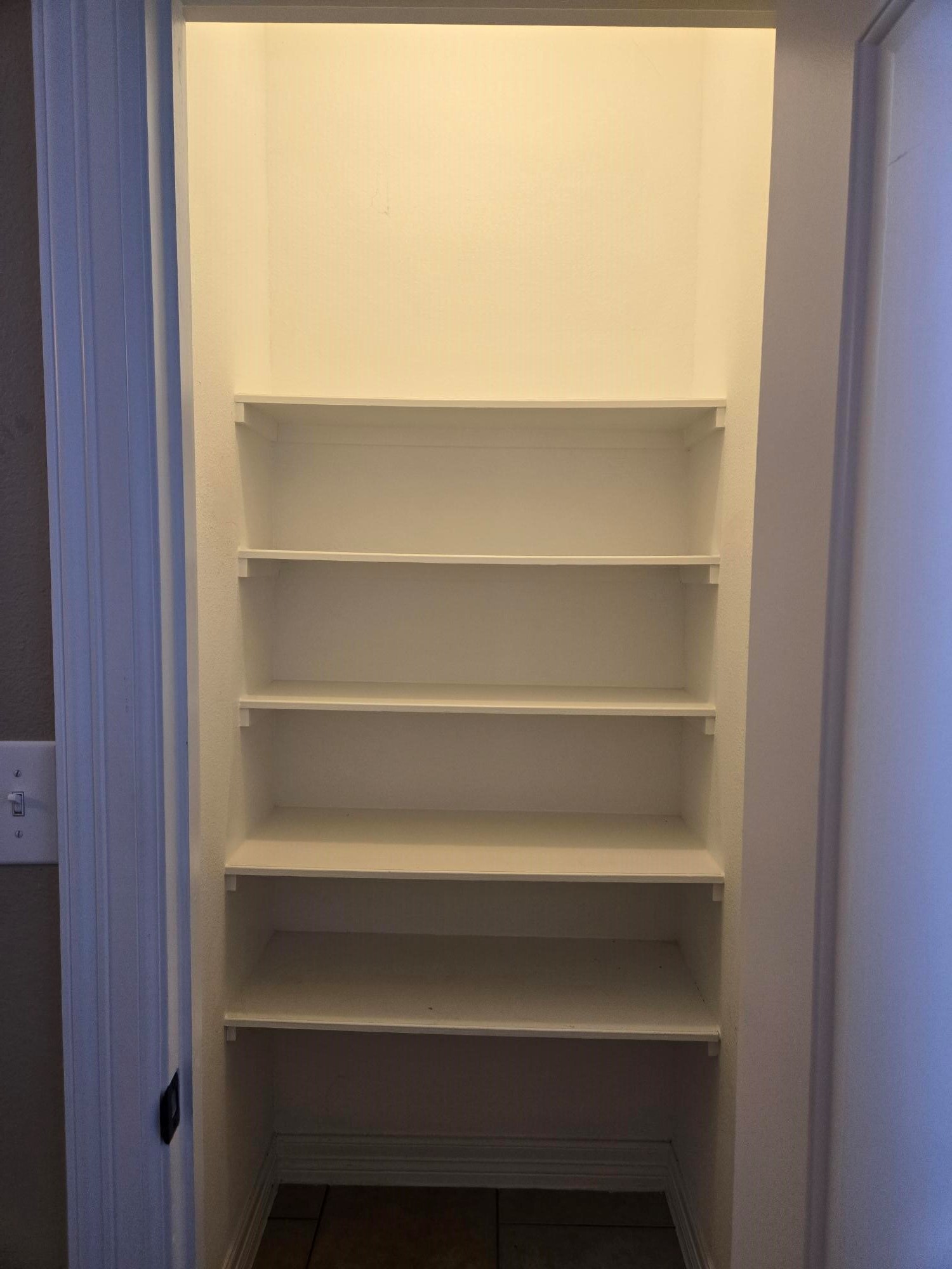 306 Masterson Street Arcola, TX 77583 - Photo 12 of 28 a view of walk in closet with empty racks