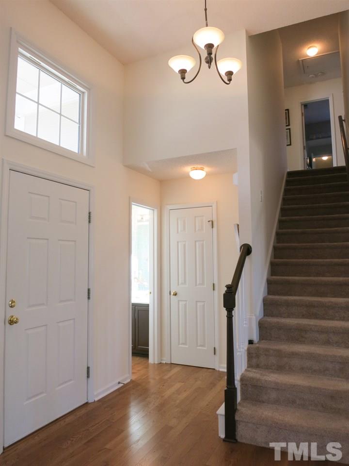 8824 Whitby Court Raleigh, NC 27615 - Photo 3 of 25 Welcoming Foyer w/hardwood floor & 12’ ceiling.