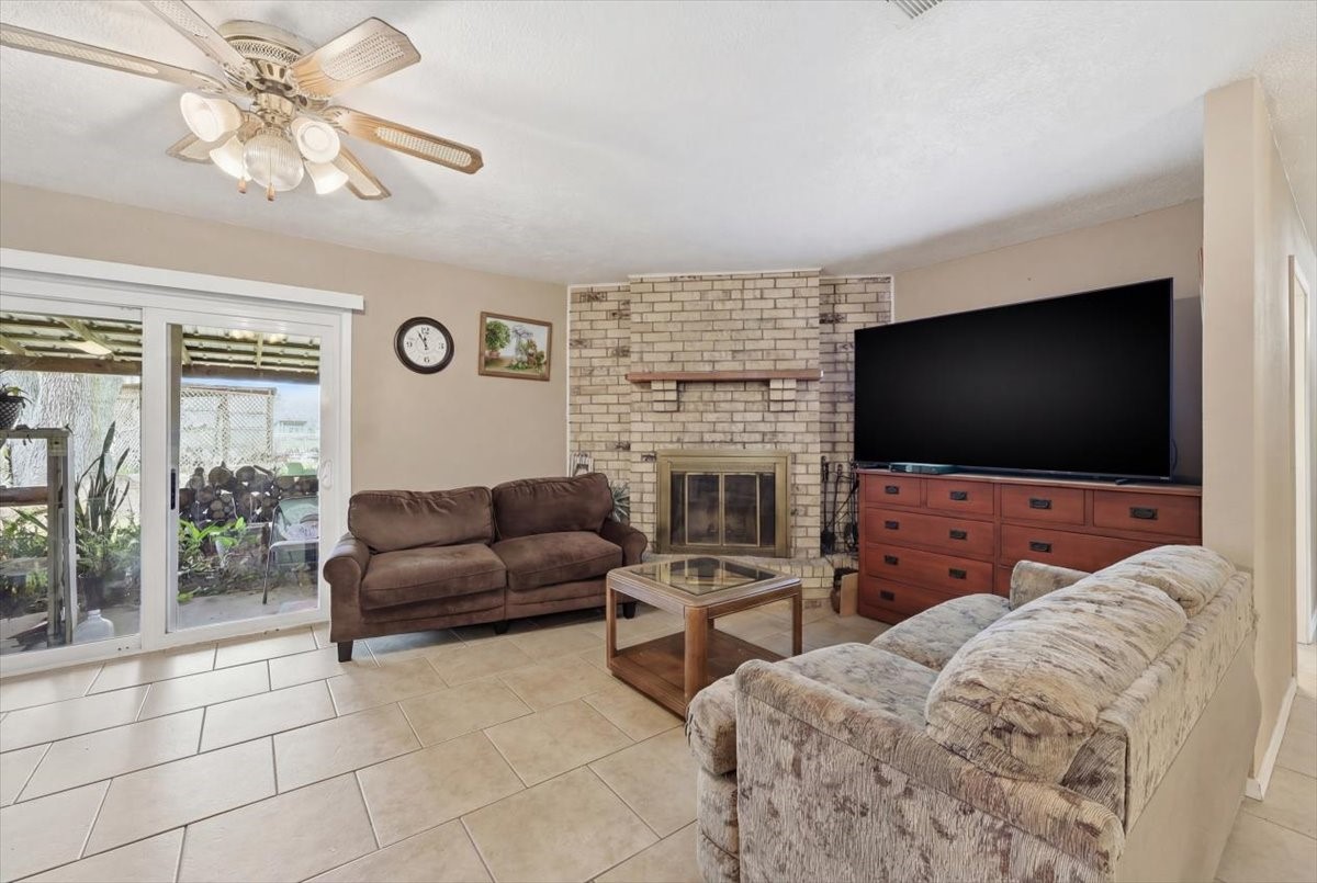 134 Meneley Road Winnie, TX 77665 - Photo 12 of 42 a living room with furniture and a flat screen tv