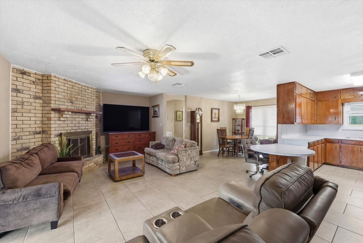 134 Meneley Road Winnie, TX 77665 - Photo 13 of 42 a living room with furniture or couch and a flat screen tv