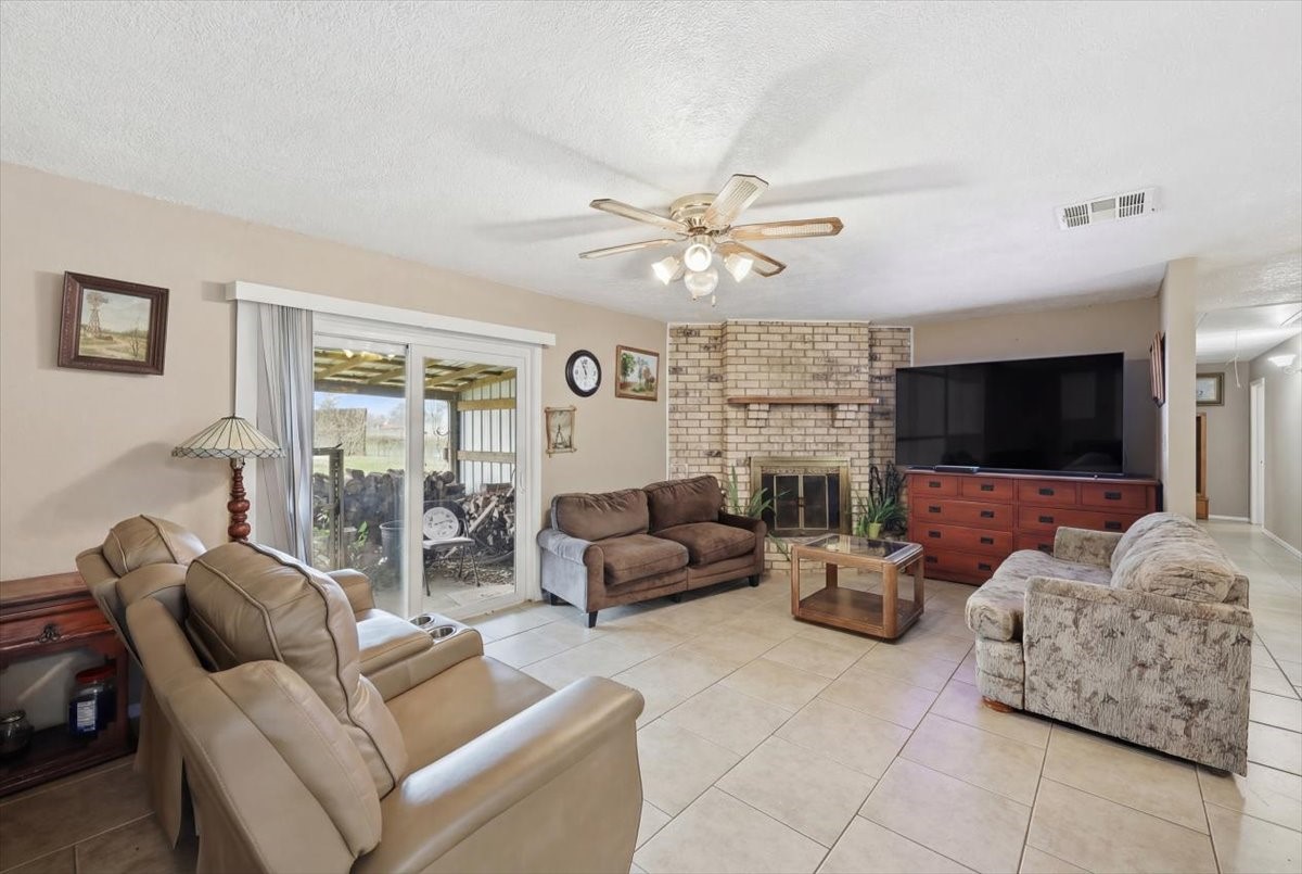 134 Meneley Road Winnie, TX 77665 - Photo 14 of 42 a living room with furniture and a flat screen tv