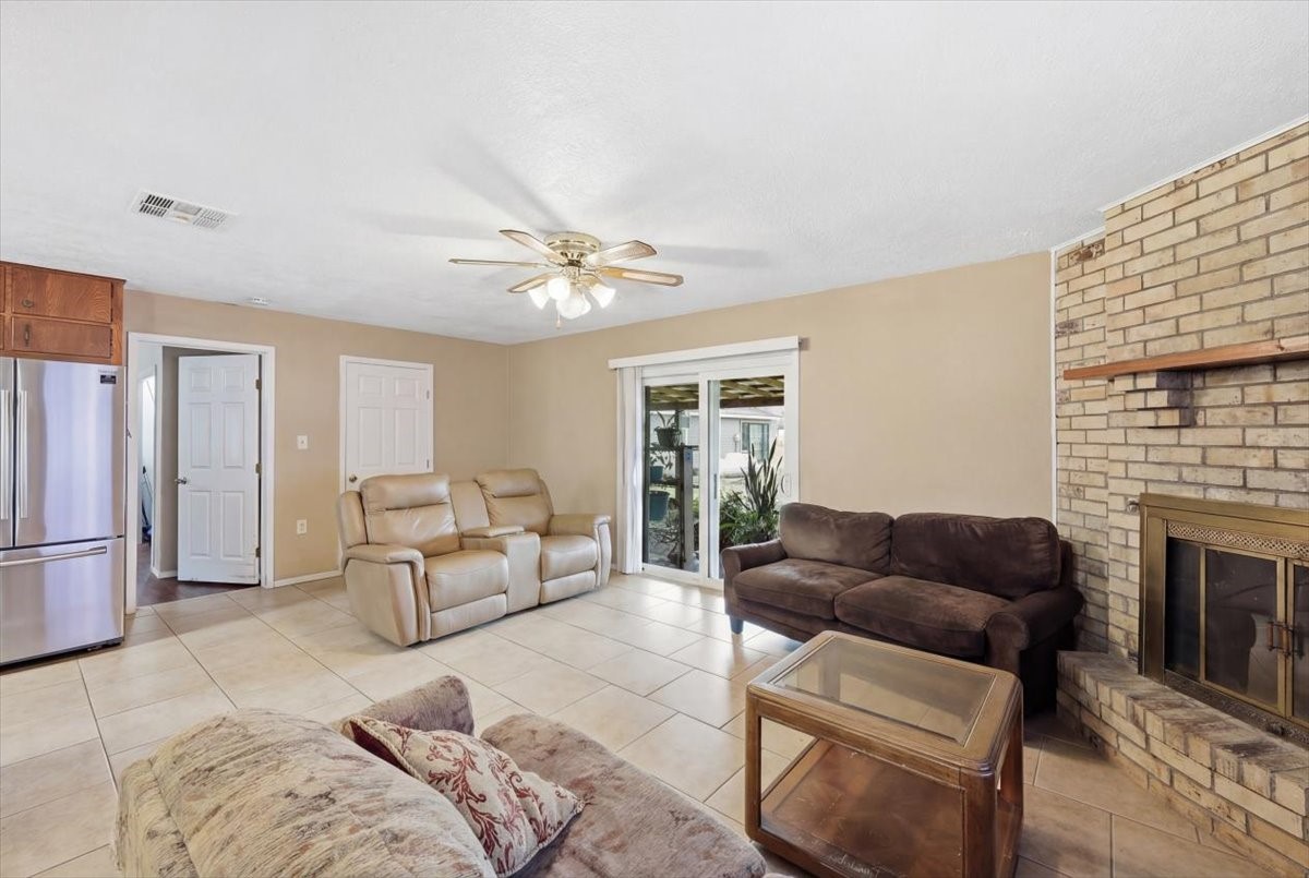 134 Meneley Road Winnie, TX 77665 - Photo 15 of 42 a living room with furniture fireplace and a fireplace