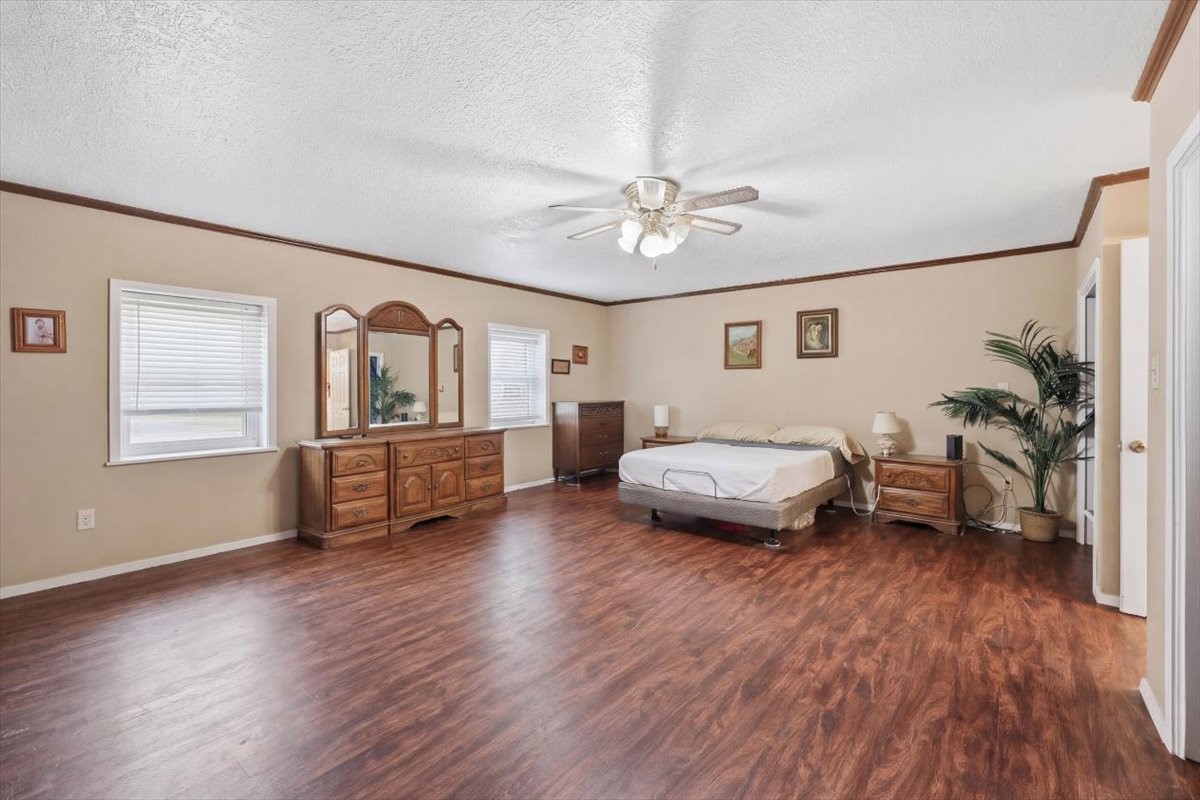 134 Meneley Road Winnie, TX 77665 - Photo 26 of 42 a living room with furniture and a wooden floor