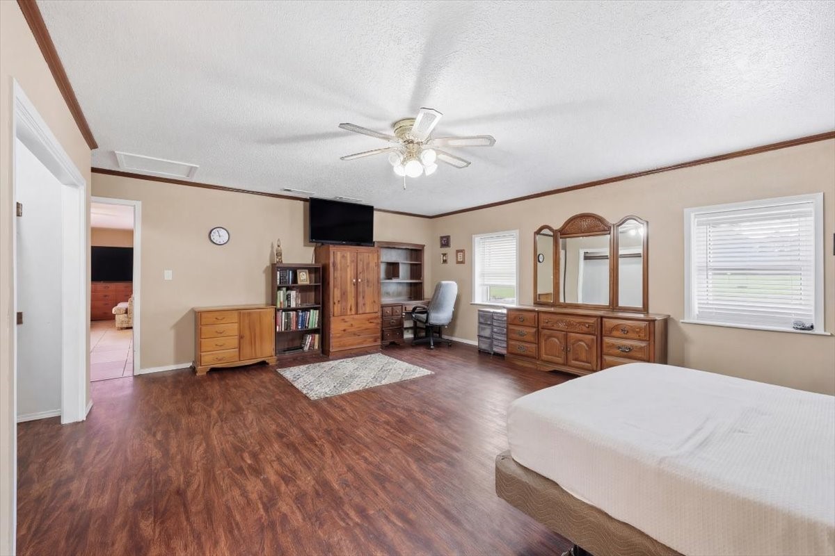 134 Meneley Road Winnie, TX 77665 - Photo 30 of 42 a living room with furniture and wooden floor
