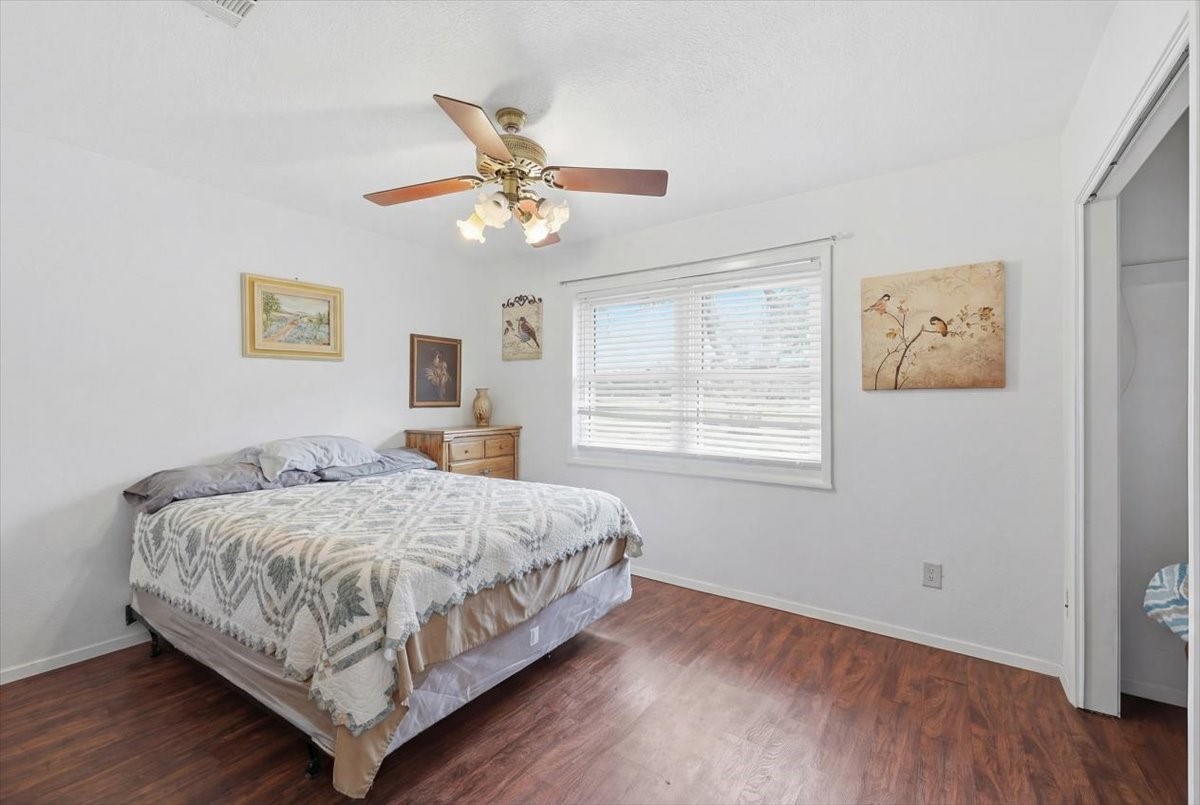 134 Meneley Road Winnie, TX 77665 - Photo 31 of 42 a bedroom with a bed and window