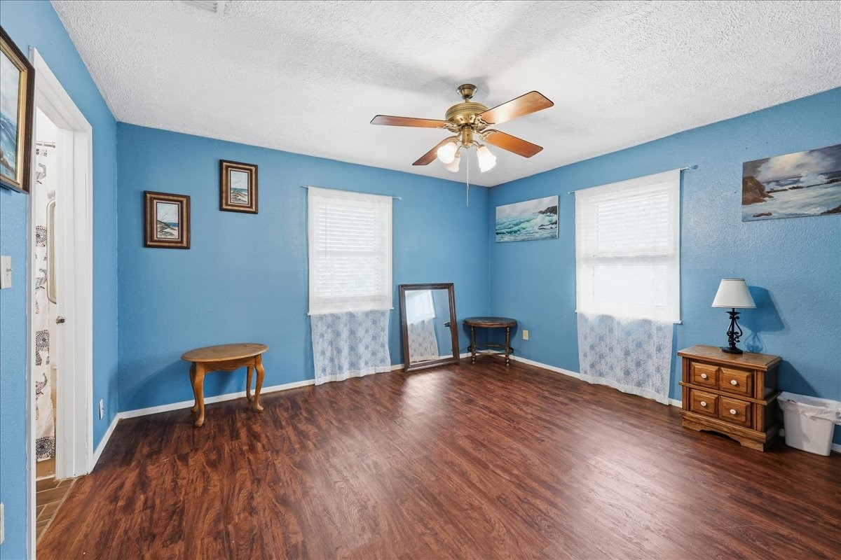 134 Meneley Road Winnie, TX 77665 - Photo 34 of 42 a bedroom with furniture and a window