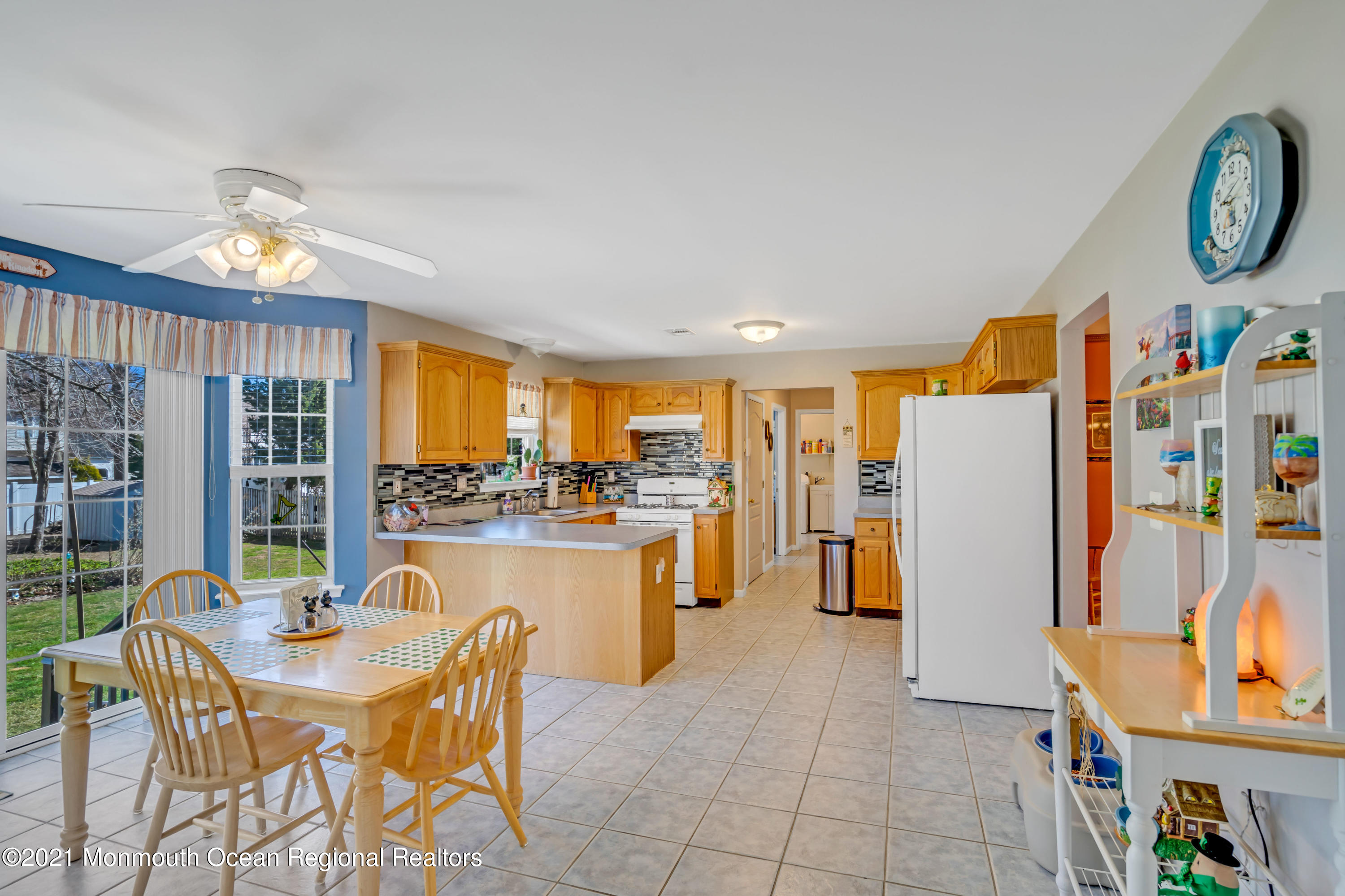 336 Meadowood Road Jackson, NJ 08527 - Photo 13 of 33 a dining room filled with furniture and a large window