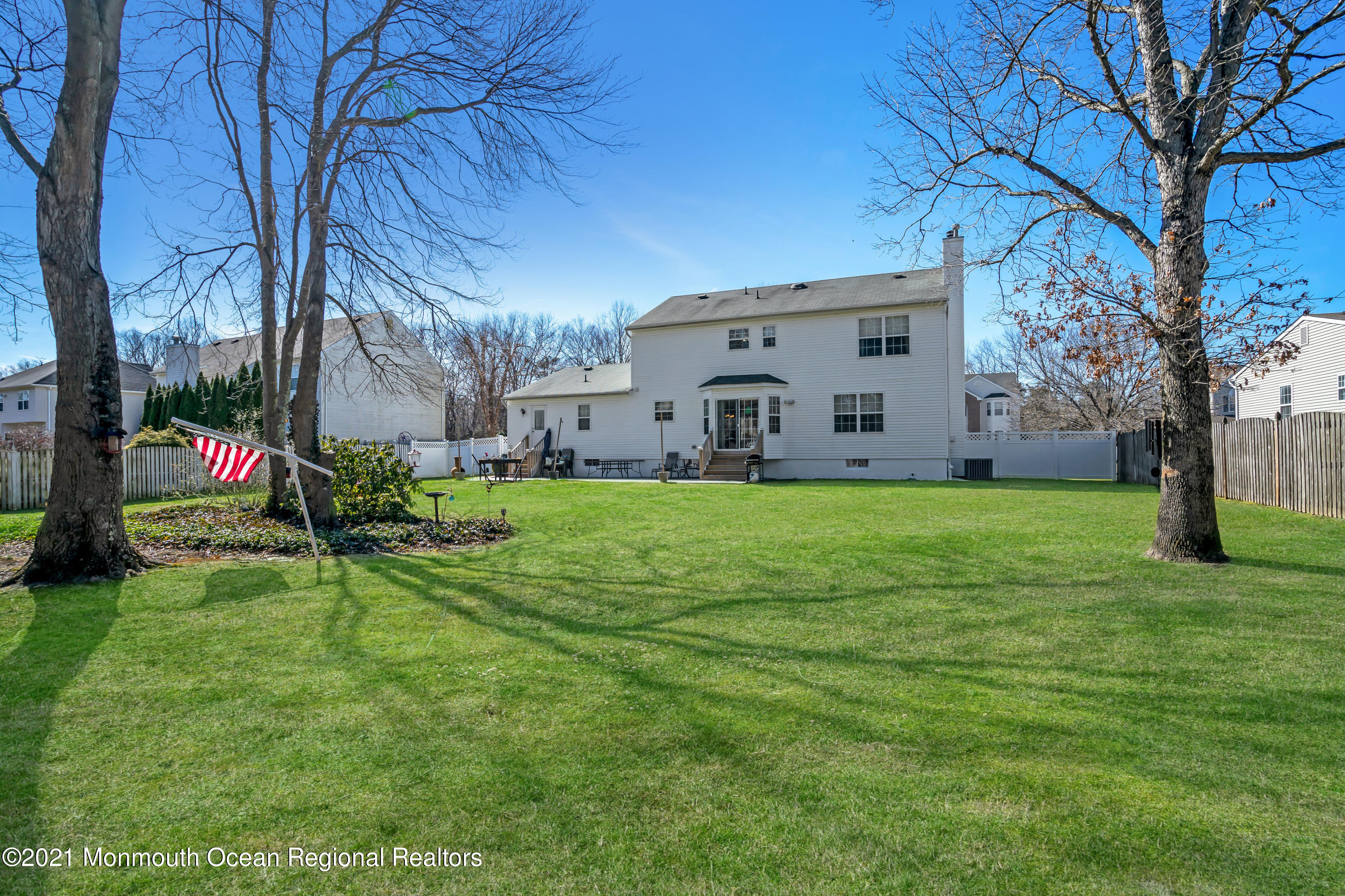336 Meadowood Road Jackson, NJ 08527 - Photo 31 of 33 a view of a house with a big yard and large tree