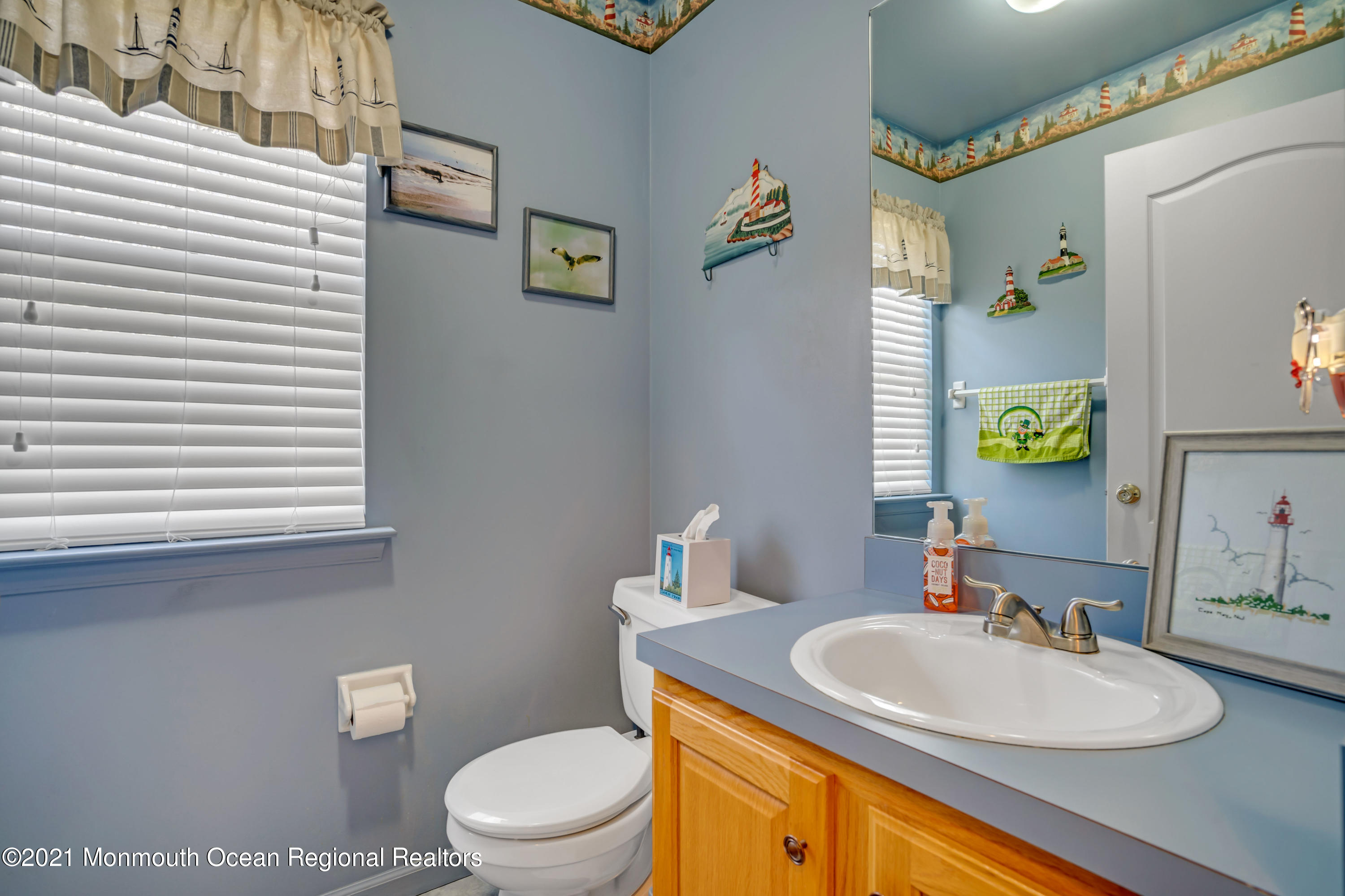 336 Meadowood Road Jackson, NJ 08527 - Photo 9 of 33 a bathroom with a granite countertop sink and a mirror