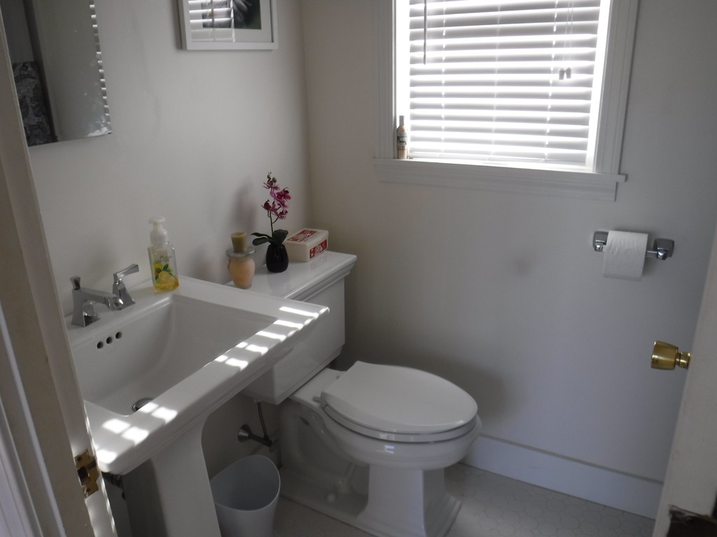 85 St Nicholas Avenue Worcester, MA 01606 - Photo 16 of 28 a bathroom with a toilet a sink and a window