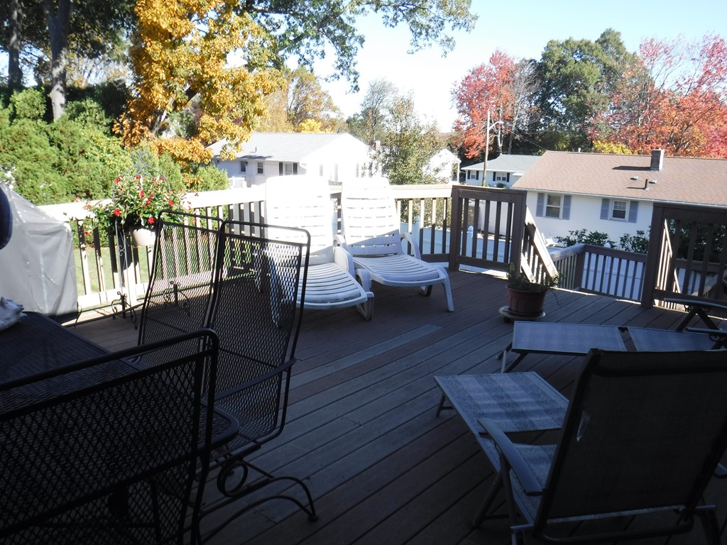 85 St Nicholas Avenue Worcester, MA 01606 - Photo 19 of 28 a view of a patio with table and chairs with wooden floor and fence