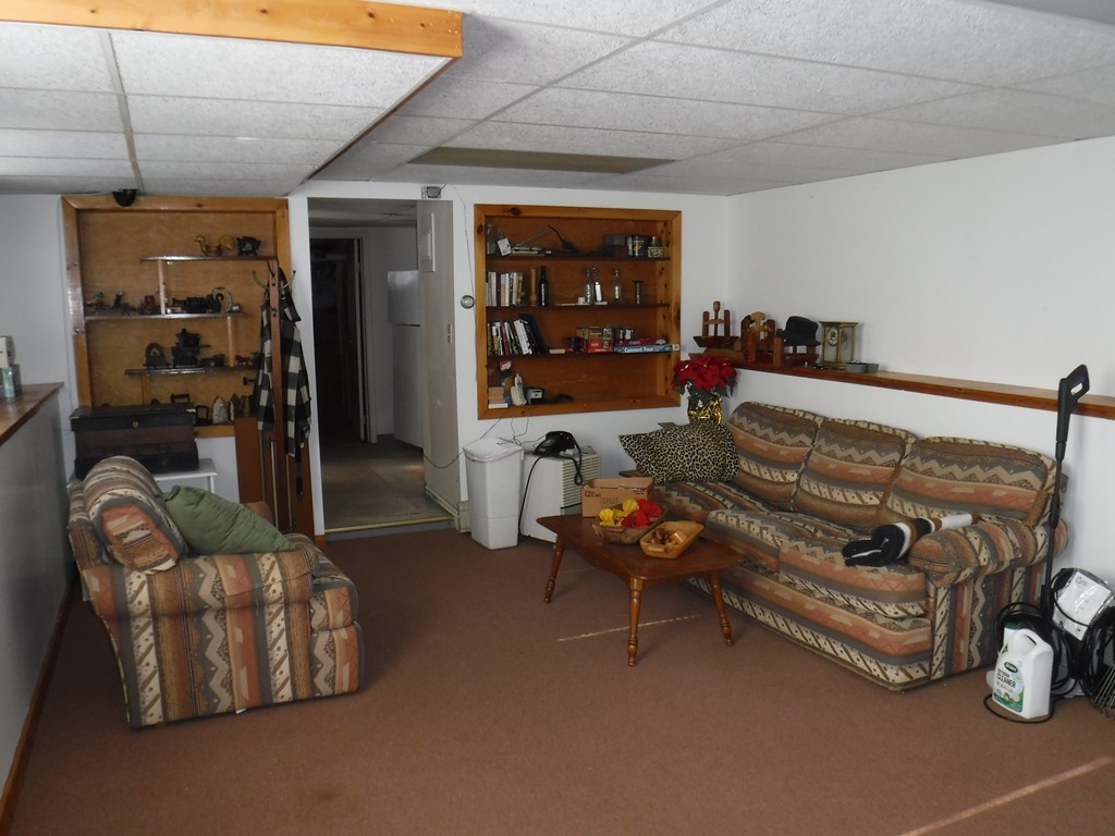 85 St Nicholas Avenue Worcester, MA 01606 - Photo 28 of 28 a living room with furniture a window and a flat screen tv