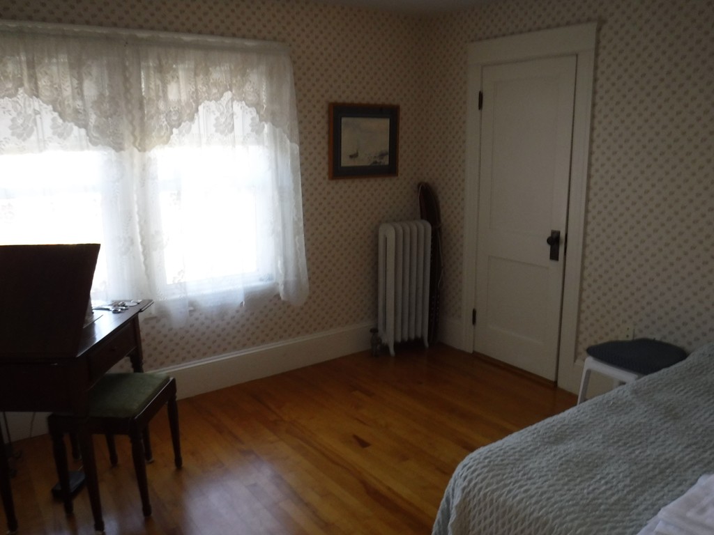 85 St Nicholas Avenue Worcester, MA 01606 - Photo 5 of 28 a bedroom with a bed and a window
