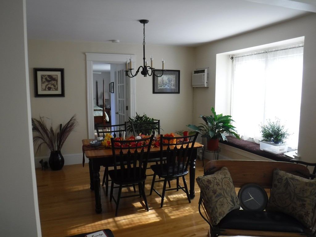 85 St Nicholas Avenue Worcester, MA 01606 - Photo 9 of 28 a view of a dining room with furniture and wooden floor