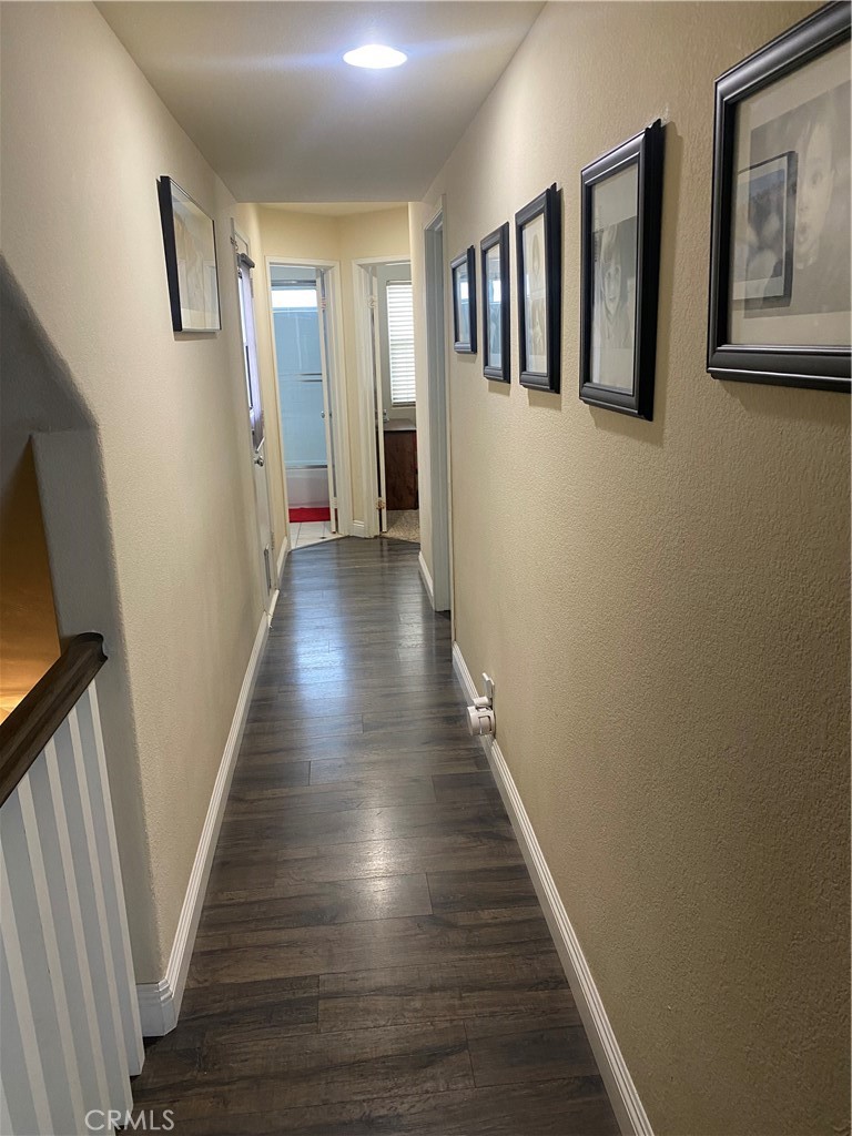 620 4th Street Hermosa Beach, CA 90254 - Photo 5 of 9 a view of a hallway with wooden floor and stairs