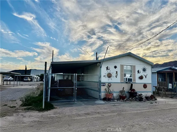 a view of a car park in front of house
