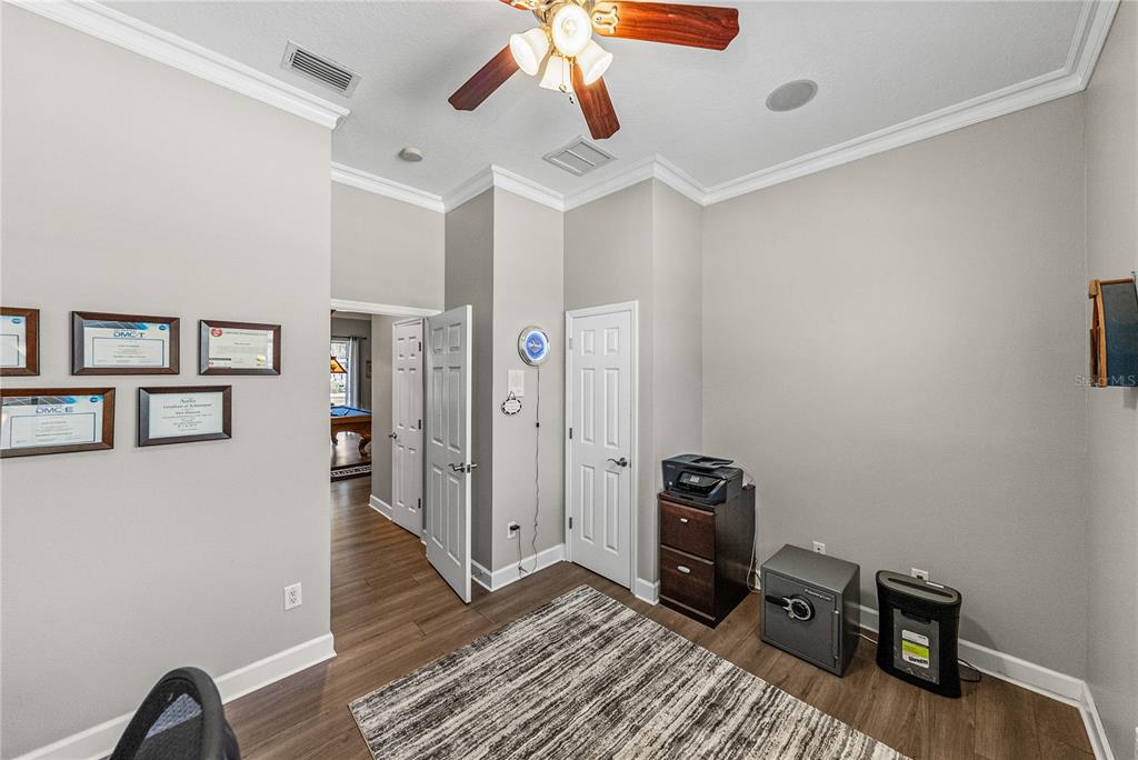 27154 Raven Brook Road Wesley Chapel, FL 33544 - Photo 34 of 65 a view of a workspace with furniture and wooden floor