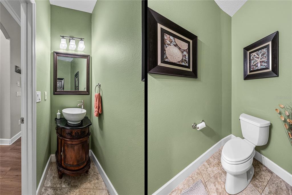 27154 Raven Brook Road Wesley Chapel, FL 33544 - Photo 35 of 65 a bathroom with a toilet and a sink