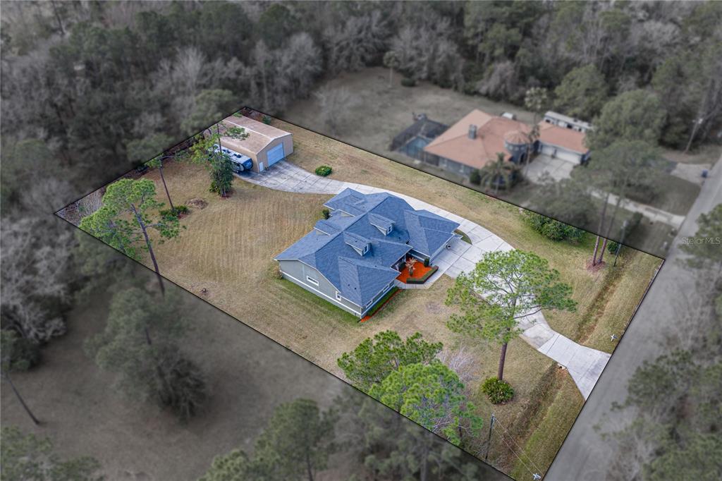 27154 Raven Brook Road Wesley Chapel, FL 33544 - Photo 5 of 65 an aerial view of a house with outdoor space