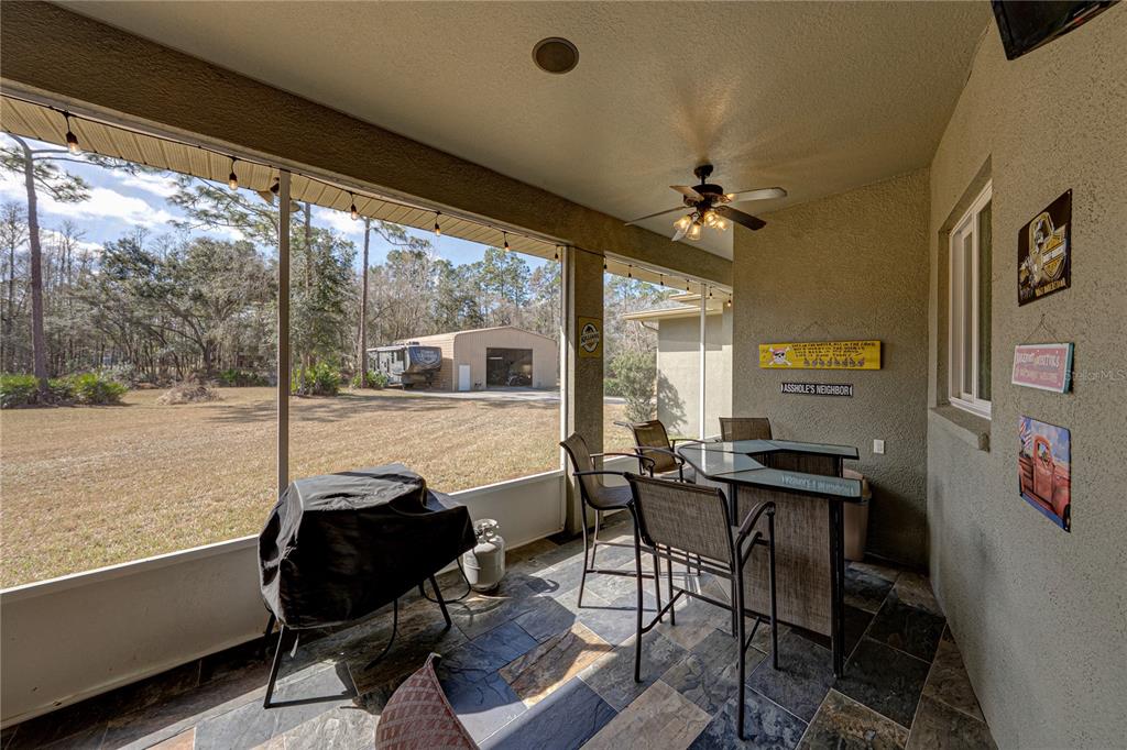 27154 Raven Brook Road Wesley Chapel, FL 33544 - Photo 54 of 65 a view of a workspace with furniture and a window