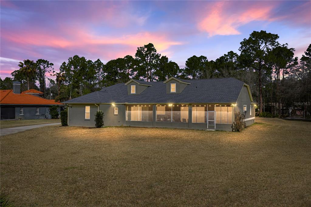 27154 Raven Brook Road Wesley Chapel, FL 33544 - Photo 55 of 65 a front view of a house with a yard and garage