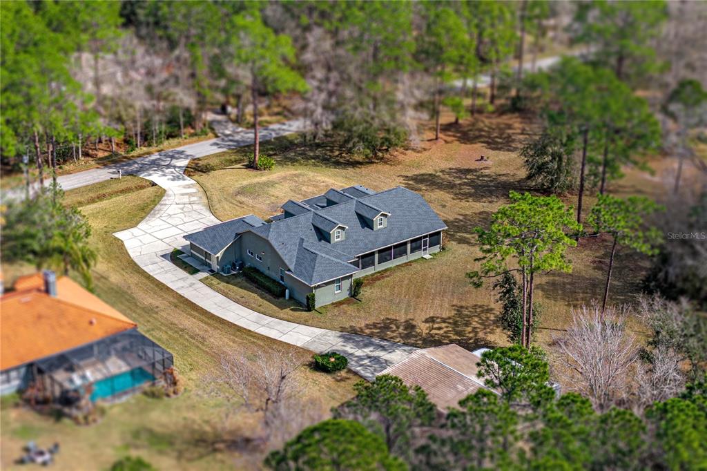 27154 Raven Brook Road Wesley Chapel, FL 33544 - Photo 56 of 65 an aerial view of a house with outdoor space