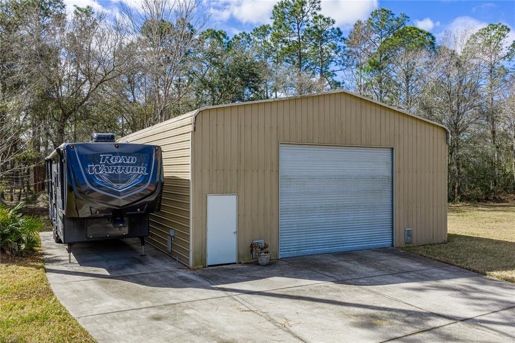 27154 Raven Brook Road Wesley Chapel, FL 33544 - Photo 59 of 65 a view of an outdoor sitting area with brick walls
