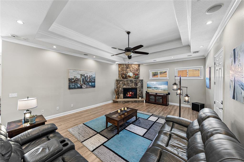 27154 Raven Brook Road Wesley Chapel, FL 33544 - Photo 9 of 65 a living room with furniture and a flat screen tv