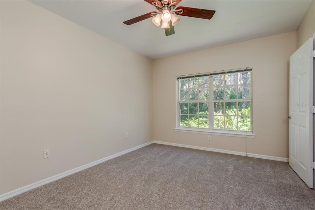 3521 Kings Road, Unit 102 Palm Harbor, FL 34685 - Photo 15 of 50 an empty room with a window
