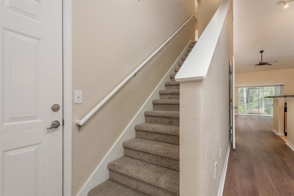 3521 Kings Road, Unit 102 Palm Harbor, FL 34685 - Photo 17 of 50 a view of entryway and hall with wooden floor
