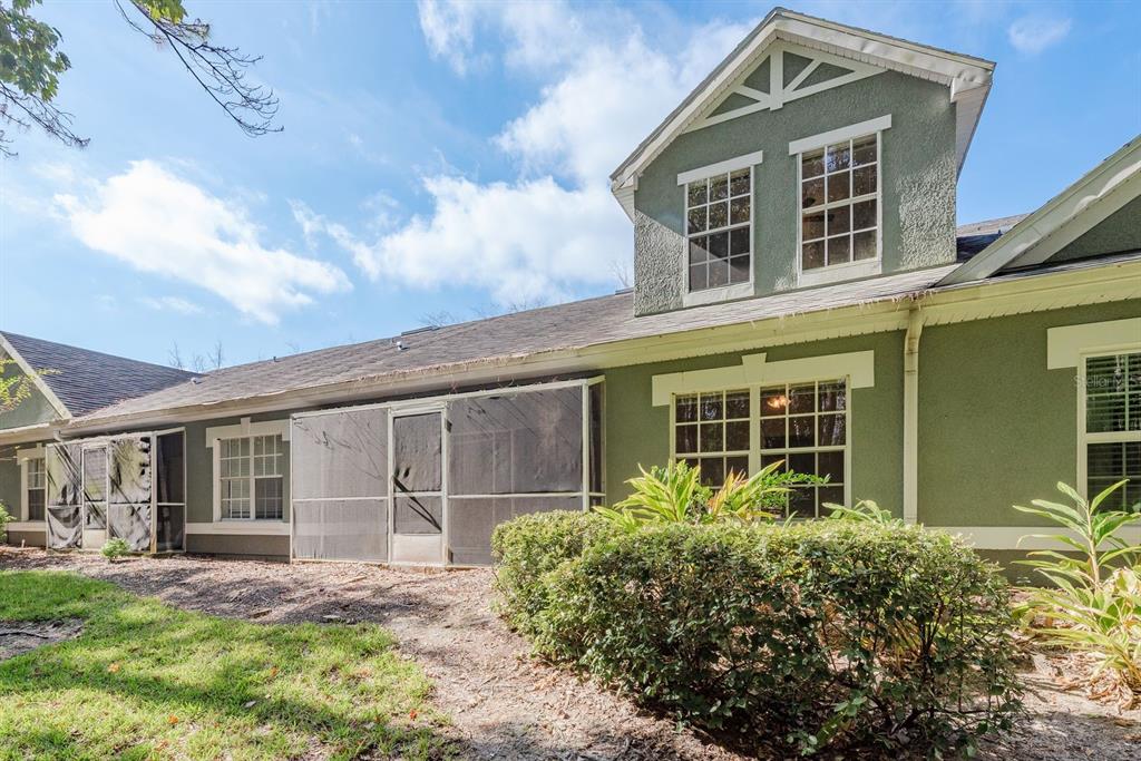 3521 Kings Road, Unit 102 Palm Harbor, FL 34685 - Photo 28 of 50 front view of a house with a yard