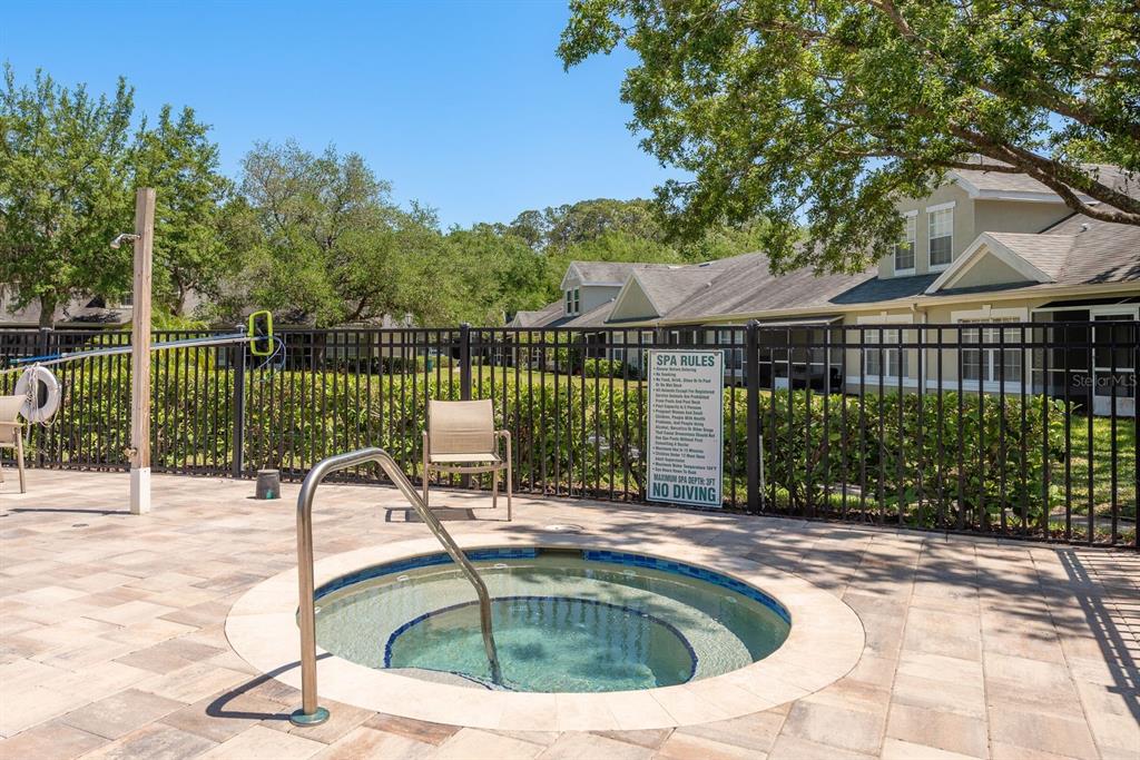 3521 Kings Road, Unit 102 Palm Harbor, FL 34685 - Photo 47 of 50 a view of a swimming pool with a patio