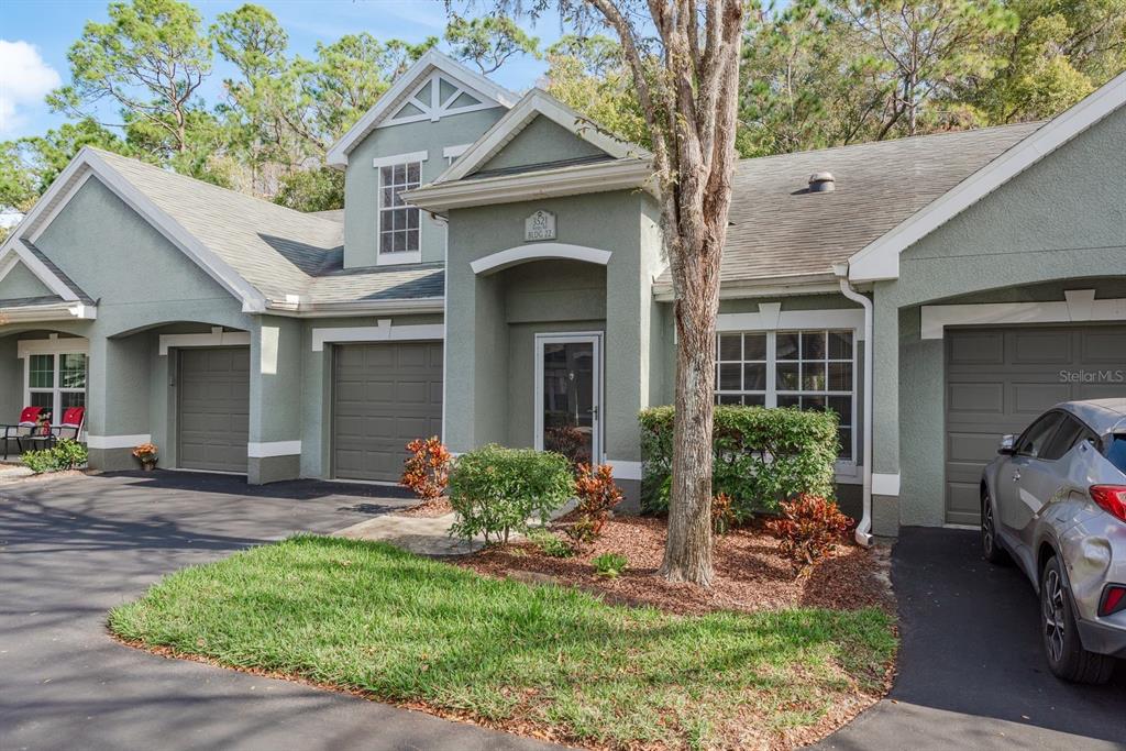 3521 Kings Road, Unit 102 Palm Harbor, FL 34685 - Photo 49 of 50 a front view of a house with garden