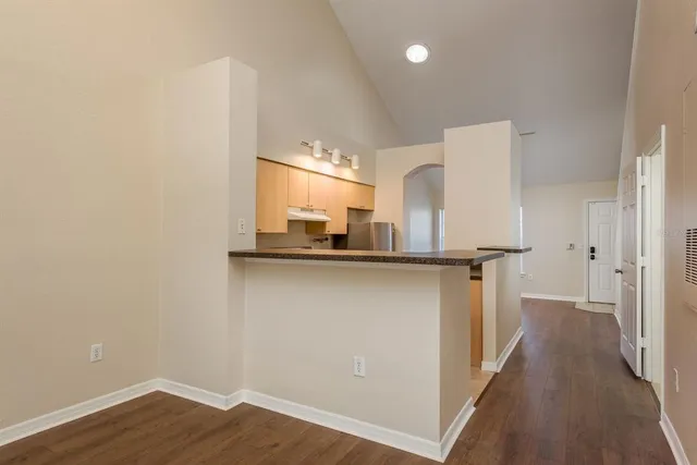 a view of a kitchen from the hallway