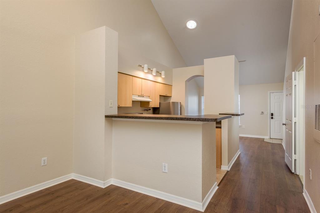 3521 Kings Road, Unit 102 Palm Harbor, FL 34685 - Photo 6 of 50 a view of a kitchen from the hallway