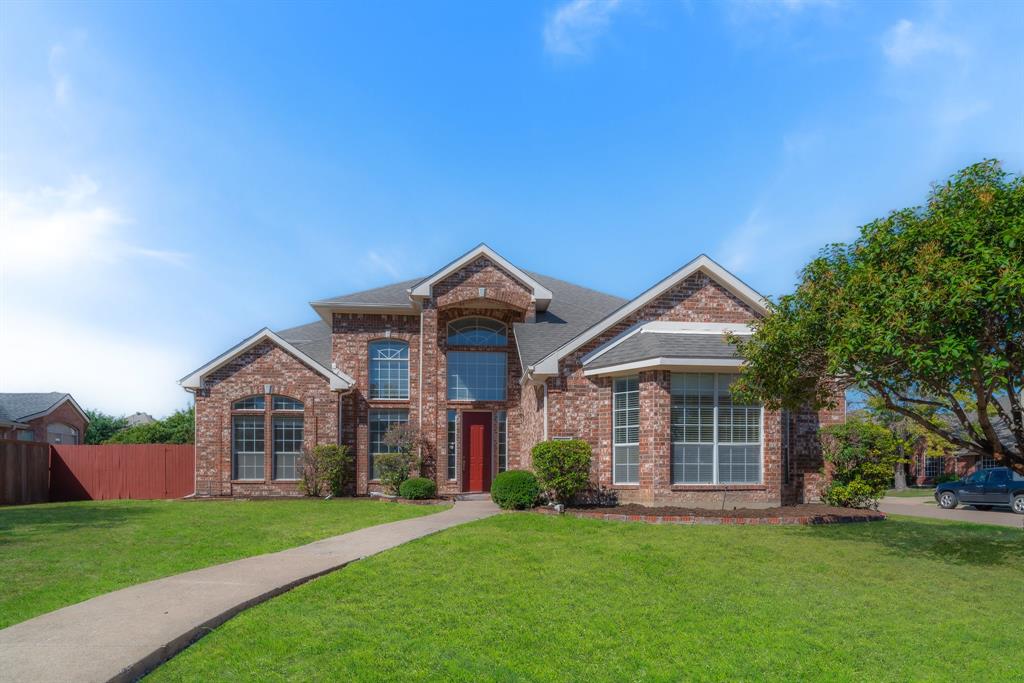 223 Briar Oak Drive Murphy, TX 75094 - Photo 1 of 1 a front view of a house with a garden and trees