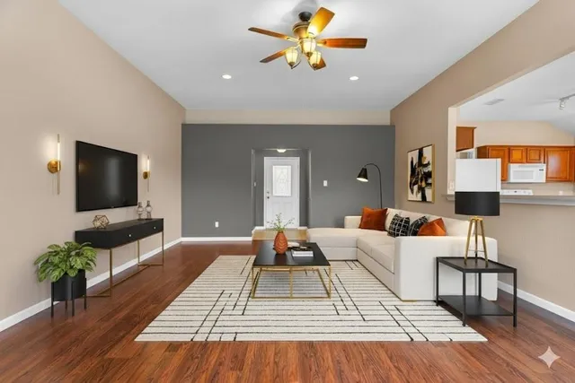 a living room with furniture fireplace and flat screen tv